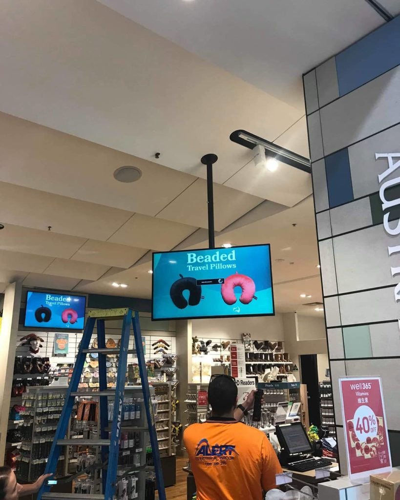 Melbourne commercial electrical contractor installs screen at Melbourne Airport store